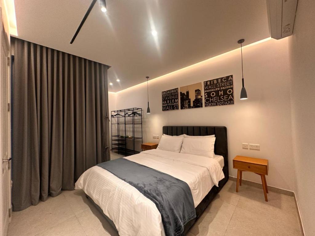 a bedroom with a large bed in a room at Desibu Collection - The Pearl St Julian's in St Julian's
