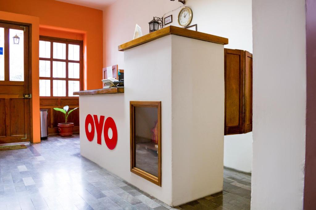 Kuchyň nebo kuchyňský kout v ubytování OYO Hotel Museo