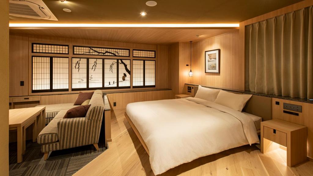 Postel nebo postele na pokoji v ubytování TERRACE HOTEL f 新大阪