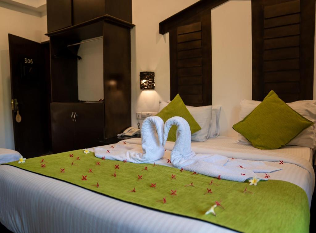 Postel nebo postele na pokoji v ubytování Sundaras Sigiriya Jungles Caves Resort