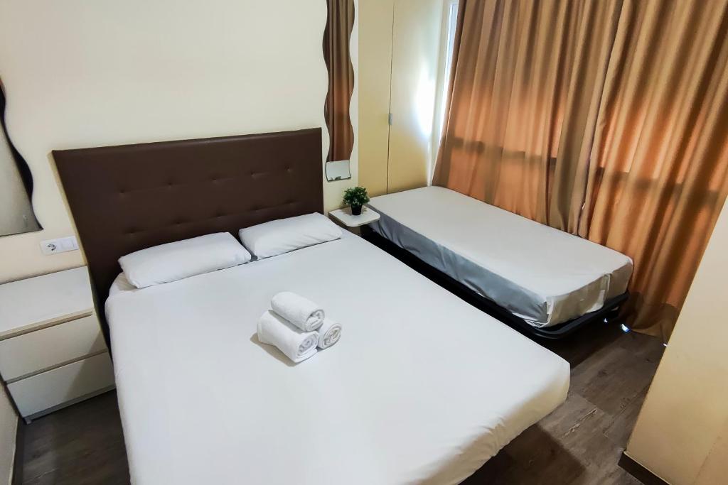 Posteľ alebo postele v izbe v ubytovaní Apartamento super luminoso