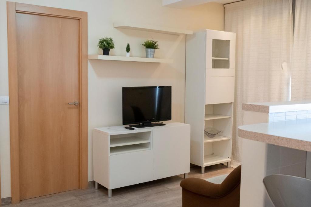 Televízia a/alebo spoločenská miestnosť v ubytovaní Apartamento super luminoso