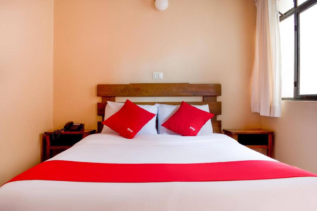 Postel nebo postele na pokoji v ubytování OYO Hotel Museo