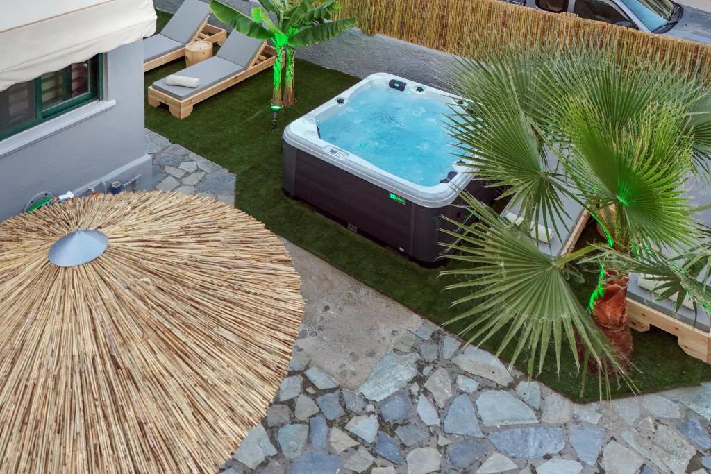 an overhead view of a hot tub in a yard with palm trees at El Dorado Corner with Hot Tub in Chania
