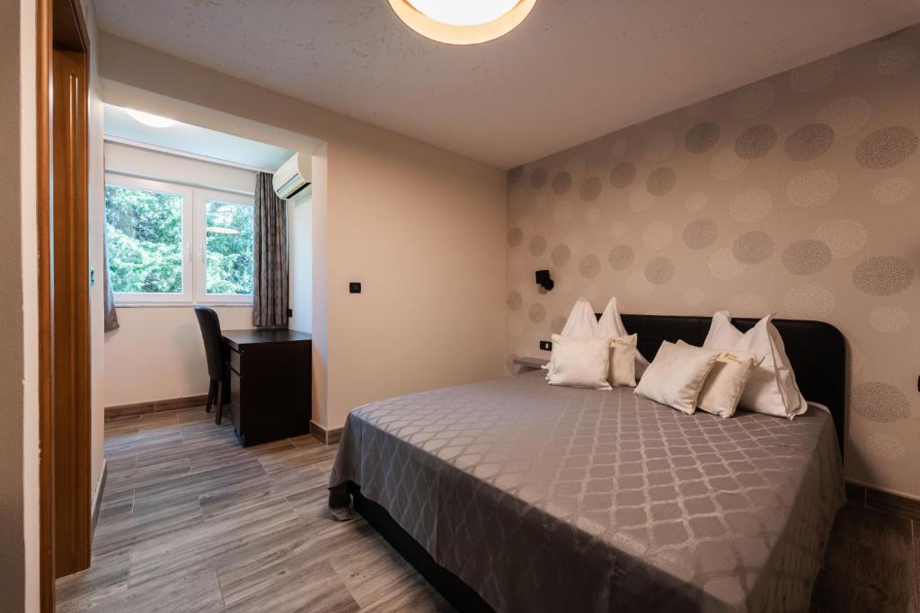 Postel nebo postele na pokoji v ubytování Bed & Breakfast Villa Terezija