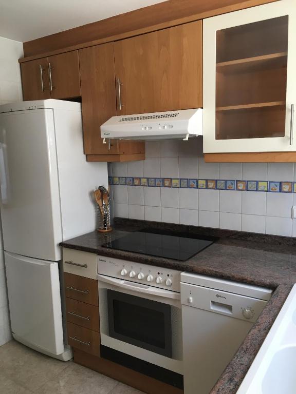 Kuchyň nebo kuchyňský kout v ubytování Adosado Playa Almadrava