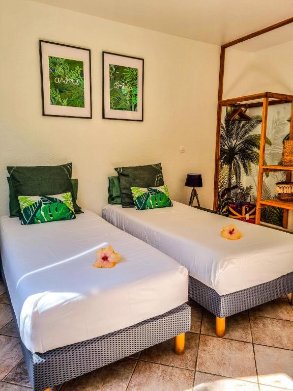 Postel nebo postele na pokoji v ubytování Maison d'hôtes Villa des Mascareignes