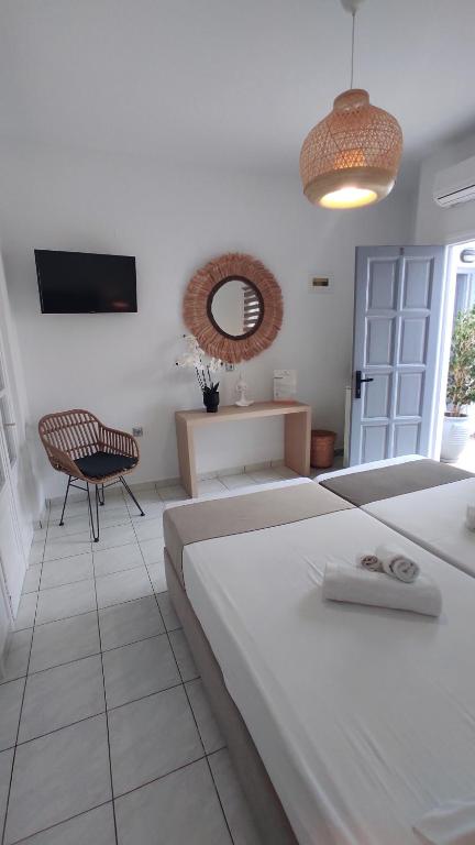 Postel nebo postele na pokoji v ubytování Chrysa House