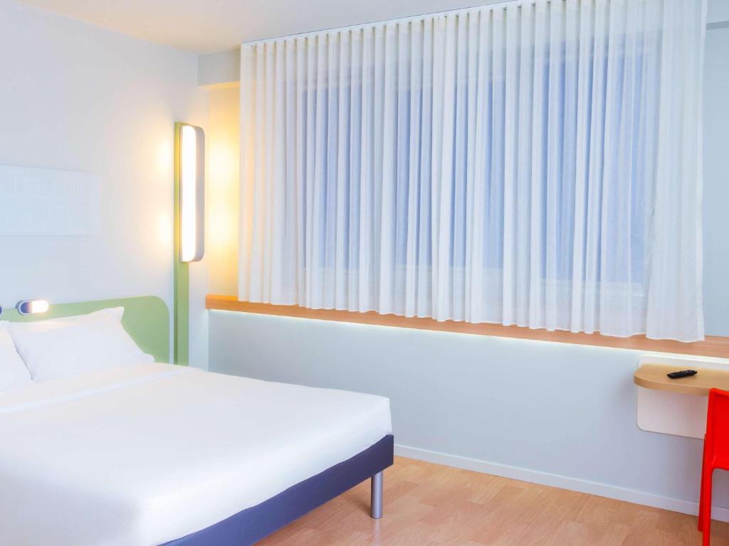 Cama o camas de una habitación en Ibis Budget Braga Centro