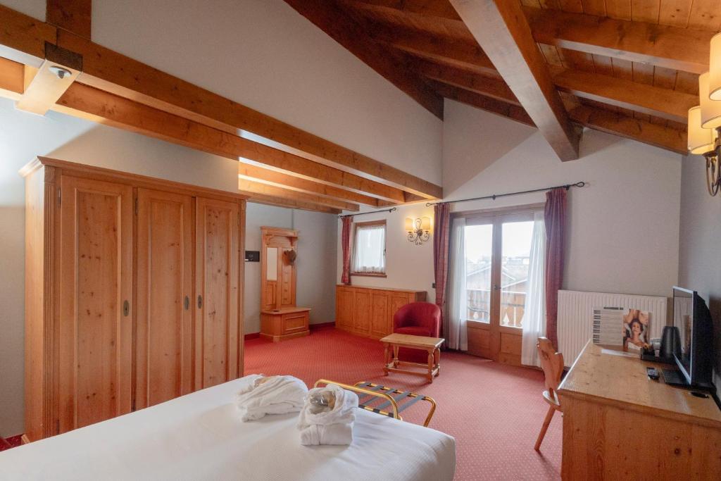 Ένα ή περισσότερα κρεβάτια σε δωμάτιο στο Gaarten Hotel Benessere Spa by Kleos Group Collection