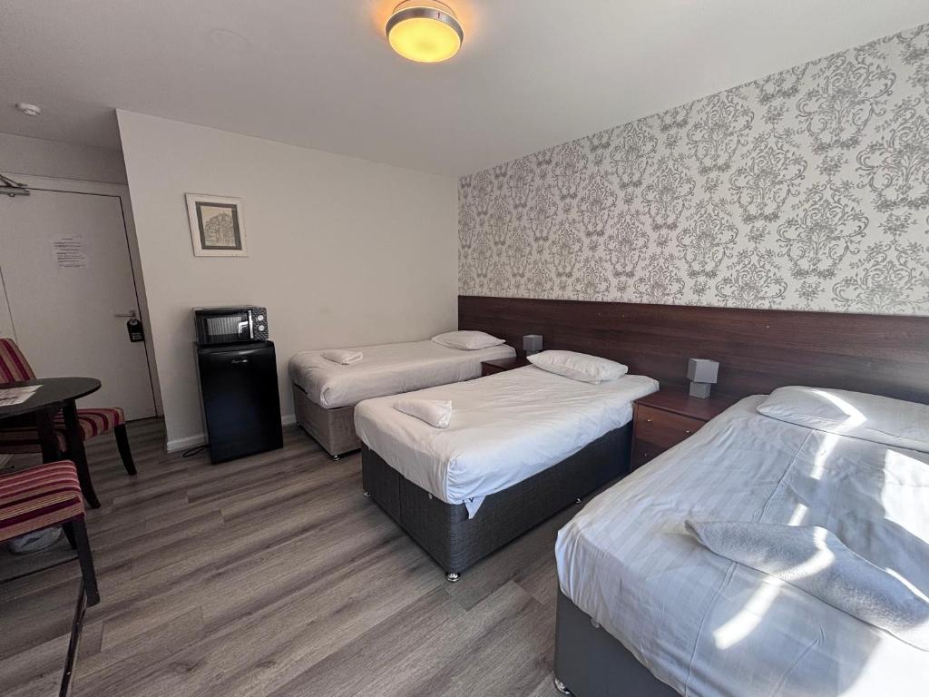 Postel nebo postele na pokoji v ubytování Park View Rooms