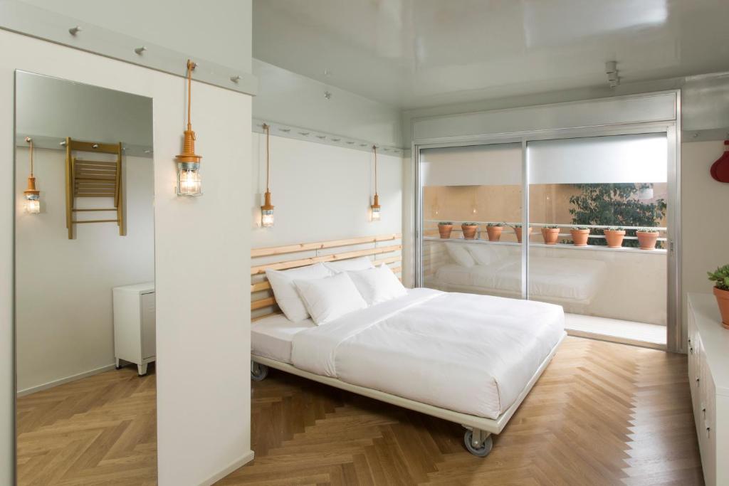 Ένα ή περισσότερα κρεβάτια σε δωμάτιο στο Florentin House