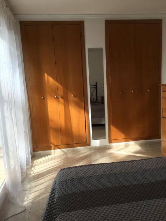 Postel nebo postele na pokoji v ubytování Adosado Playa Almadrava