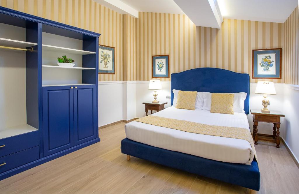 Postel nebo postele na pokoji v ubytování Boutique Hotel del Corso