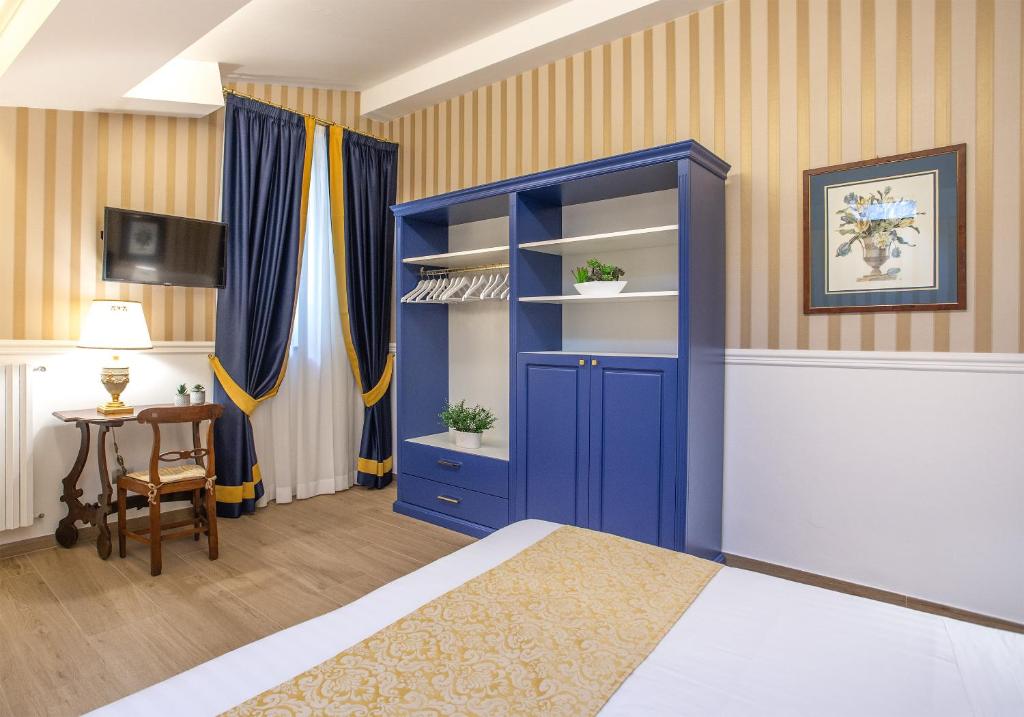 Postel nebo postele na pokoji v ubytování Boutique Hotel del Corso