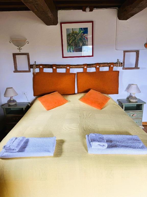 Postel nebo postele na pokoji v ubytování Monte Paradiso Agriturismo