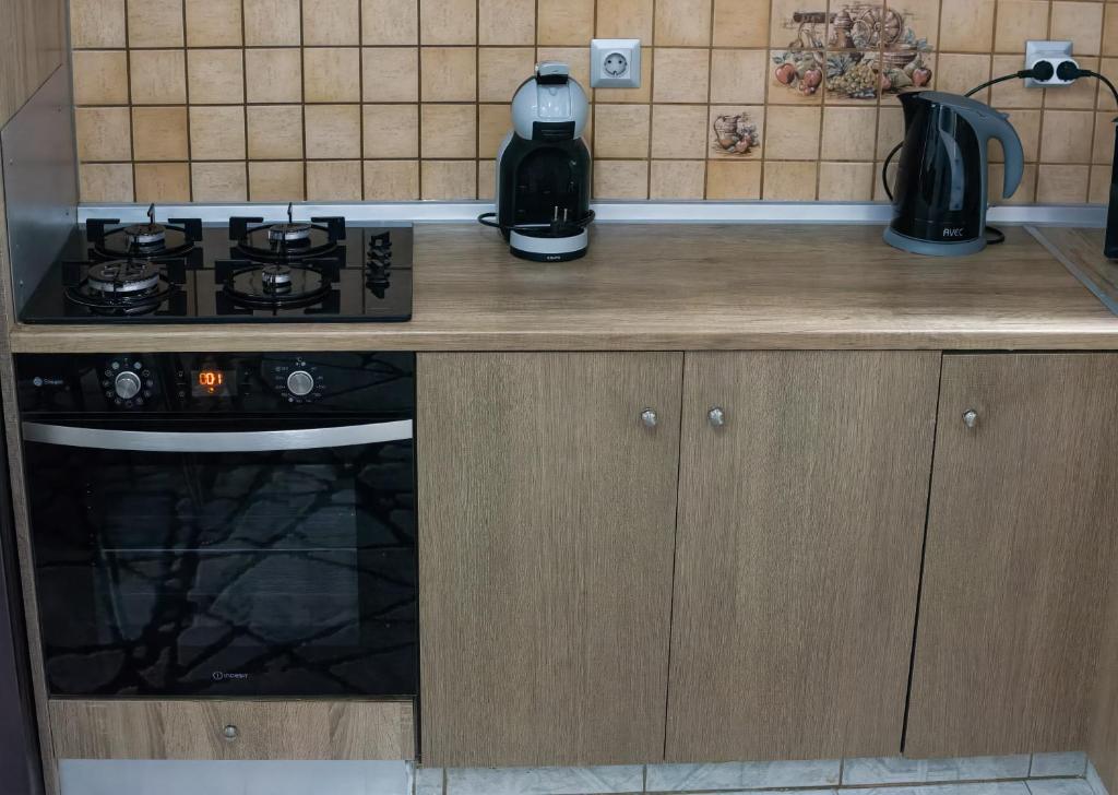Kuchyň nebo kuchyňský kout v ubytování Paradise Apartment, Lardos Village