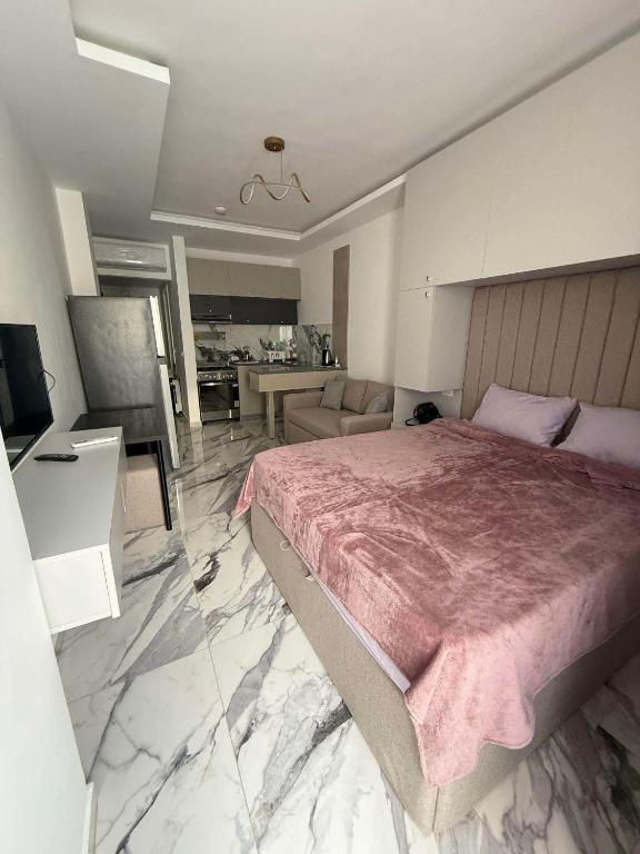 Postel nebo postele na pokoji v ubytování Orchid 40