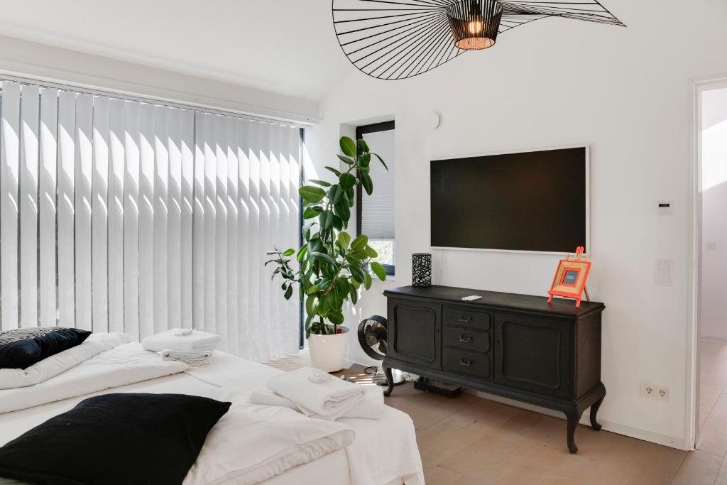 Ένα ή περισσότερα κρεβάτια σε δωμάτιο στο Architekten Haus 120 m2 in der Wetterau