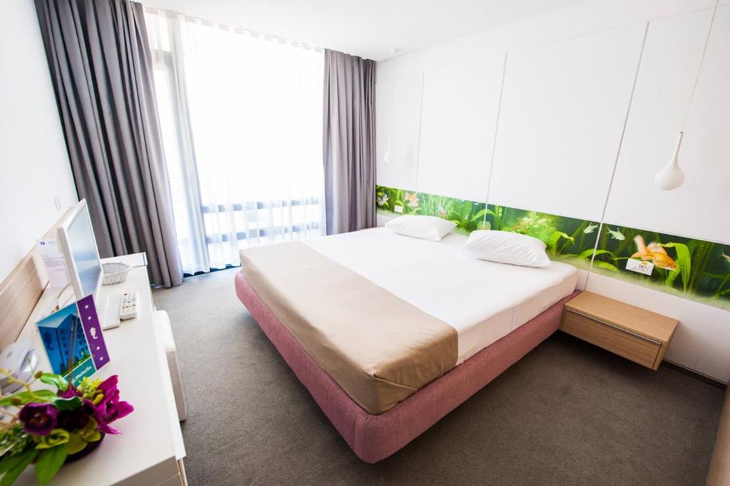 Postel nebo postele na pokoji v ubytování Hotel Melodia