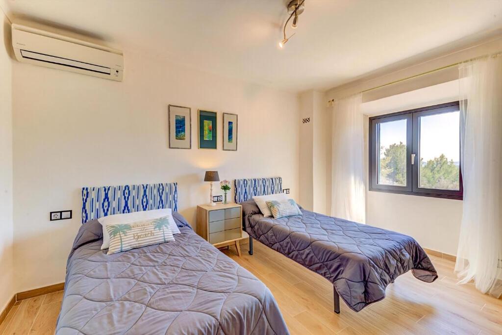 A bed or beds in a room at Tranquil Pollensa Villa Finca Plana Den Rull Set In The Beautiful Ternelles Valley Private Pool