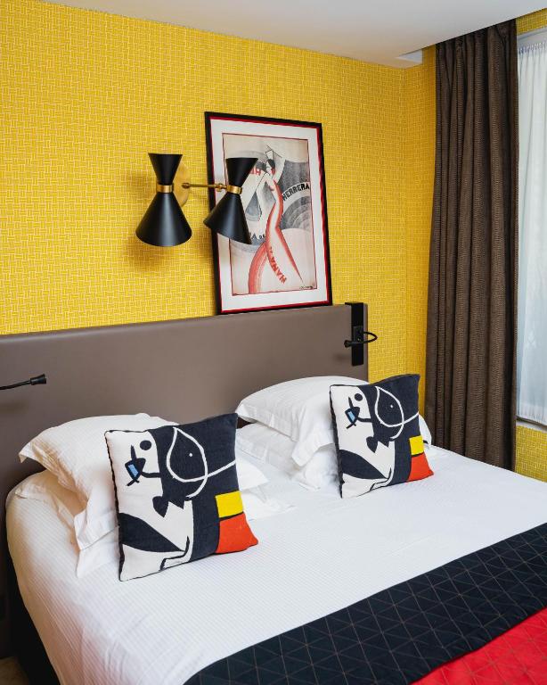 Postel nebo postele na pokoji v ubytování Hôtel Artus