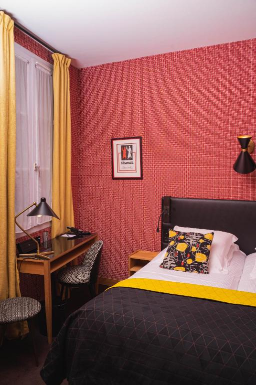 Postel nebo postele na pokoji v ubytování Hôtel Artus