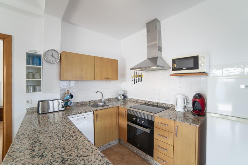 A kitchen or kitchenette at Beautiful Lanzarote Villa 3 Bedrooms Villa Strelitzia South Facing Secluded Private Pool Playa Blanca