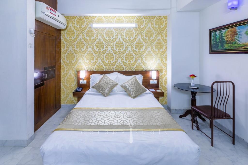Postel nebo postele na pokoji v ubytování SEL Nibash Hotel & Serviced Apartments