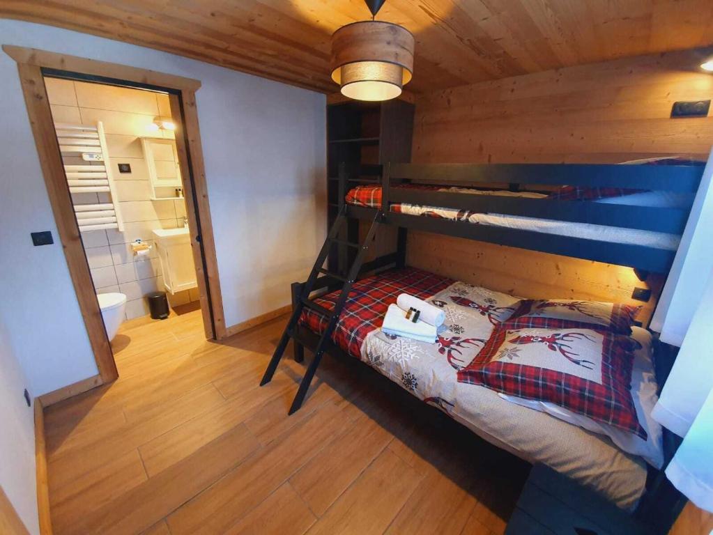 Postel nebo postele na pokoji v ubytování Chalet Delphinette - Spa privatif