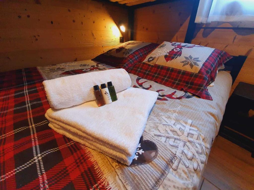 Postel nebo postele na pokoji v ubytování Chalet Delphinette - Spa privatif