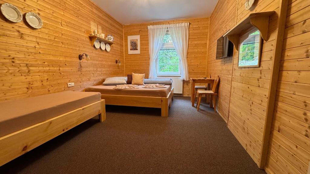 Postel nebo postele na pokoji v ubytování Penzion U Malířských