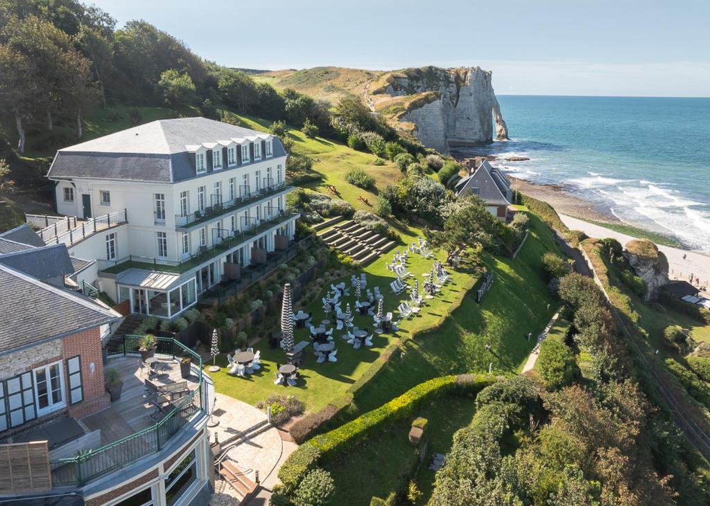 an aerial view of a hotel and the ocean at Dormy House in Étretat