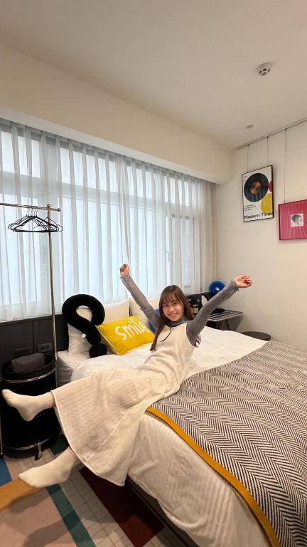 Postel nebo postele na pokoji v ubytování 台南悠墨民宿umobnb