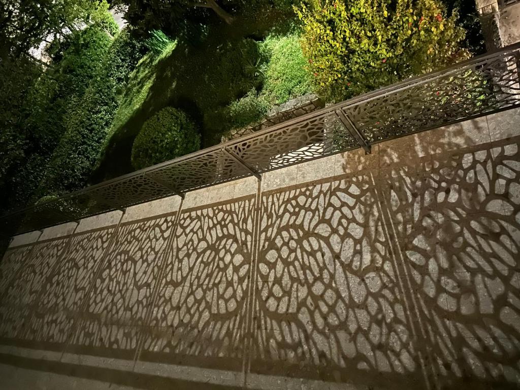 a fence with a design on the side of it at Apartment Pepi in Lovran
