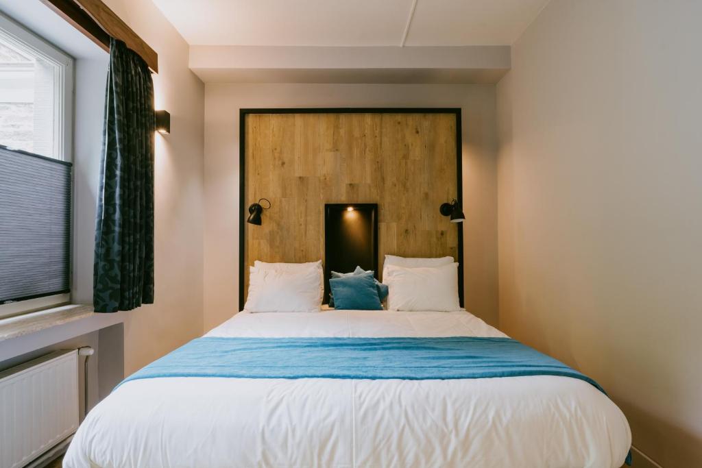 Postel nebo postele na pokoji v ubytování Hotel L'eau Vive