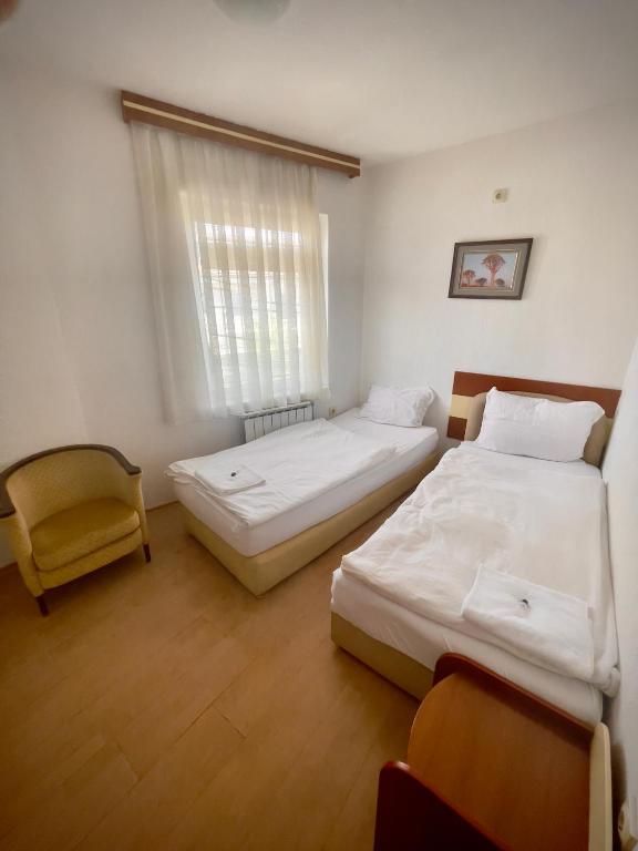 Postel nebo postele na pokoji v ubytování Hotel Ilinden