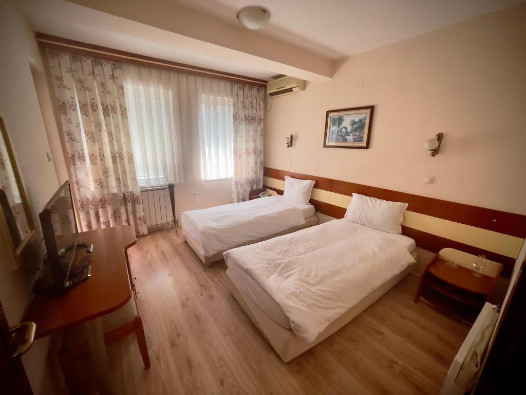 Postel nebo postele na pokoji v ubytování Hotel Ilinden