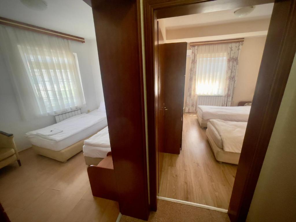 Postel nebo postele na pokoji v ubytování Hotel Ilinden