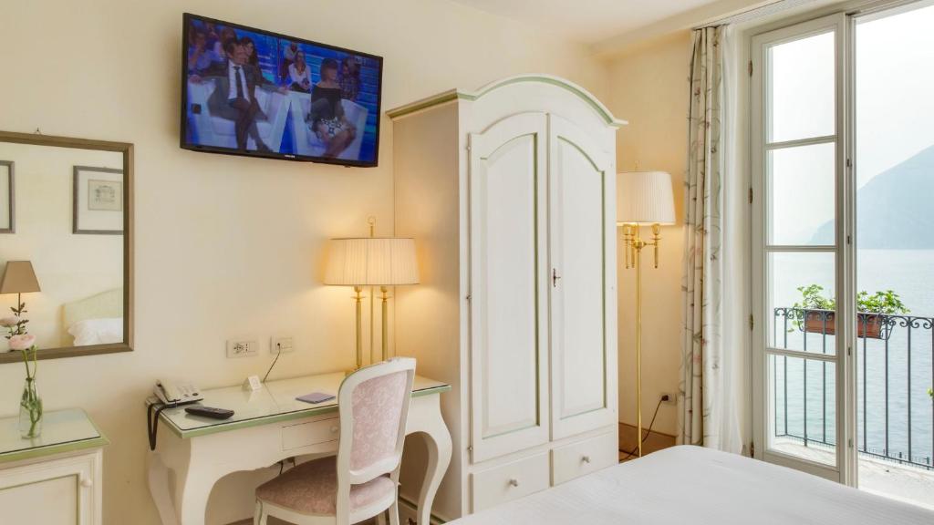 Postel nebo postele na pokoji v ubytování Hotel Rivalago