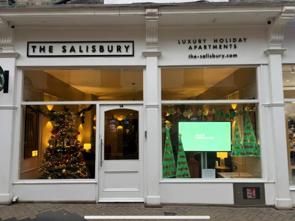 a store front with a christmas tree in the window at The Salisbury sleeps 4 Classic Apartment in Scarborough