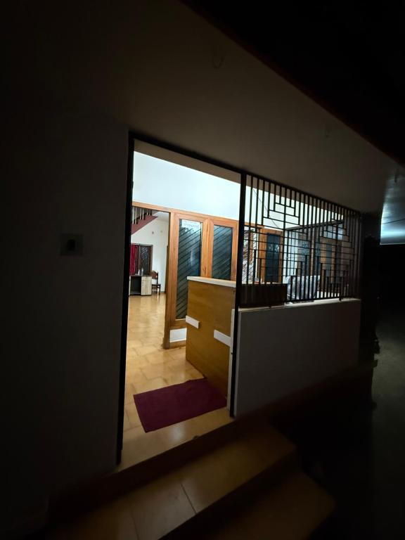 a view of a hallway from a room with a door at RJ residency in Kozhikode