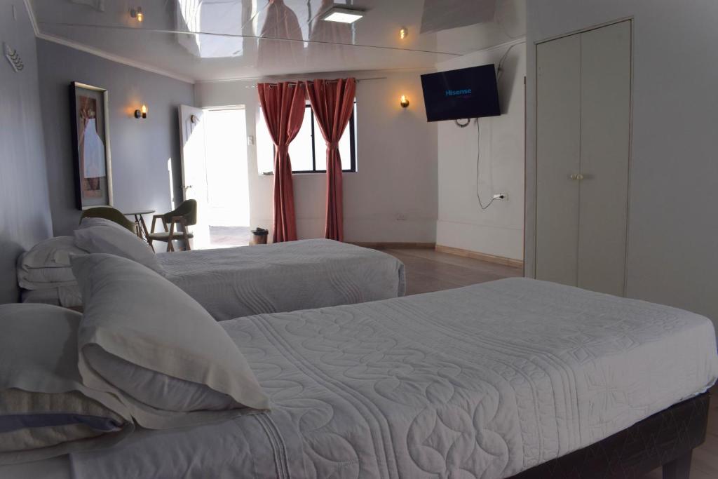 Ένα ή περισσότερα κρεβάτια σε δωμάτιο στο Hotel Flamingo