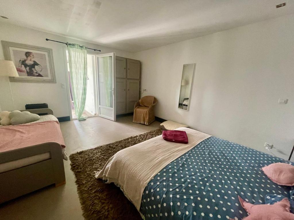 Postel nebo postele na pokoji v ubytování Le Mazet Chambre d'Hôtes