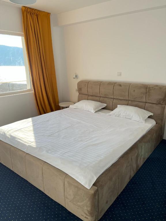 Postel nebo postele na pokoji v ubytování Anacor