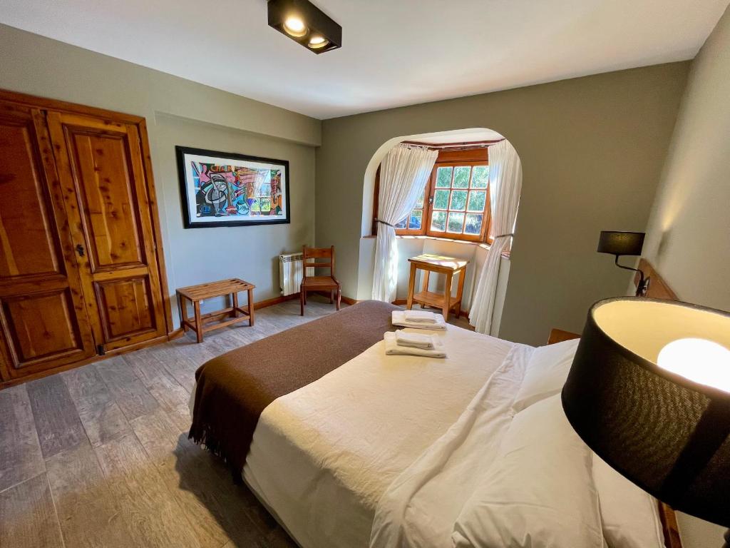 Uma cama ou camas num quarto em Las Marianas Hotel