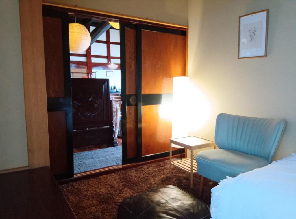 Postel nebo postele na pokoji v ubytování 駅前宿舎 禪 shared house zen