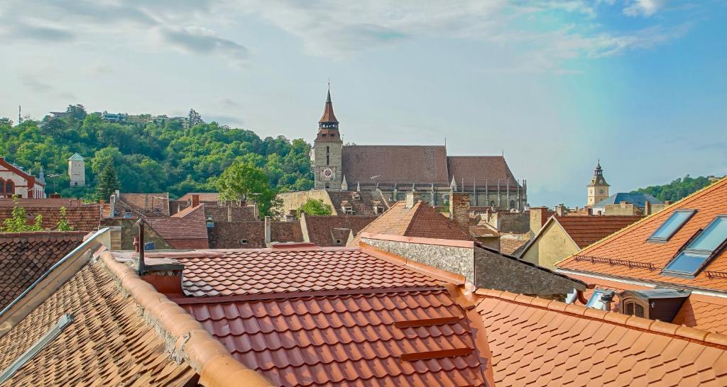 an aerial view of a town with red roofs at Rooftop proprety with Large Terrace & Stunning Views - Brașov in Braşov