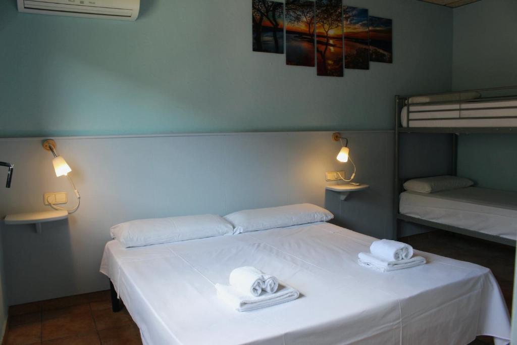 Postel nebo postele na pokoji v ubytování Hotel Al Riu