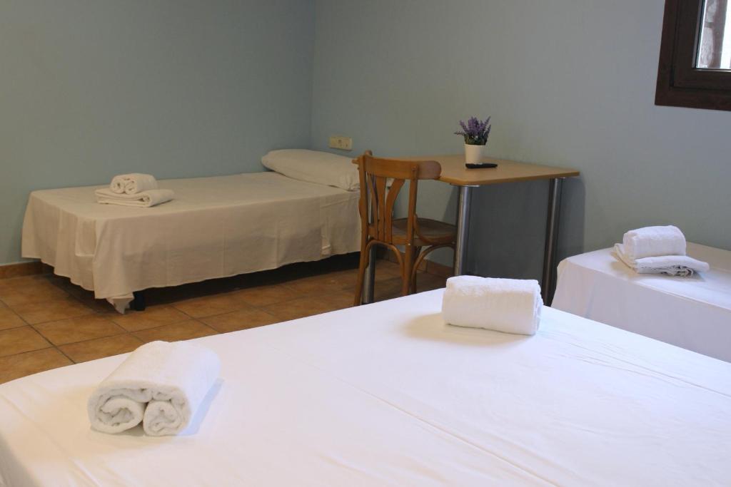 Postel nebo postele na pokoji v ubytování Hotel Al Riu